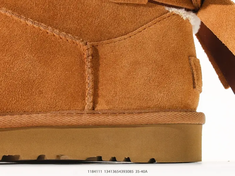 UGG WOMEN'S 高筒单丝带蝴蝶结 秋冬羊皮毛一体雪地靴 1184111 #13413654393085